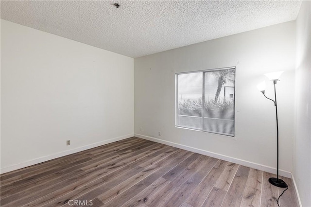 2905 Montrose Ave Unit 318, La Crescenta, CA 91214 - unfurnished room with wood finished floors, baseboards, a textured ceiling, and fire sprinkler in ceiling