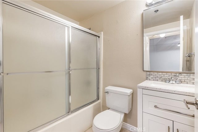 2905 Montrose Ave Unit 318, La Crescenta, CA 91214 - bathroom with tasteful backsplash, toilet, vanity, and bath / shower combo with glass door