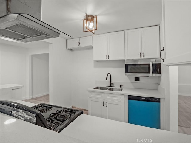 38809 Juniper Tree Rd, Palmdale, CA 93551 - kitchen with dishwasher, a sink, black gas range, island exhaust hood, and stainless steel microwave