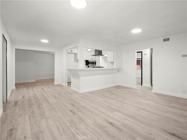 38809 Juniper Tree Rd, Palmdale, CA 93551 - unfurnished living room featuring light wood-type flooring, baseboards, and recessed lighting