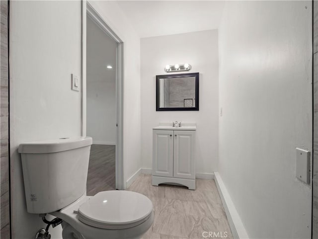38809 Juniper Tree Rd, Palmdale, CA 93551 - bathroom featuring toilet, baseboards, and vanity