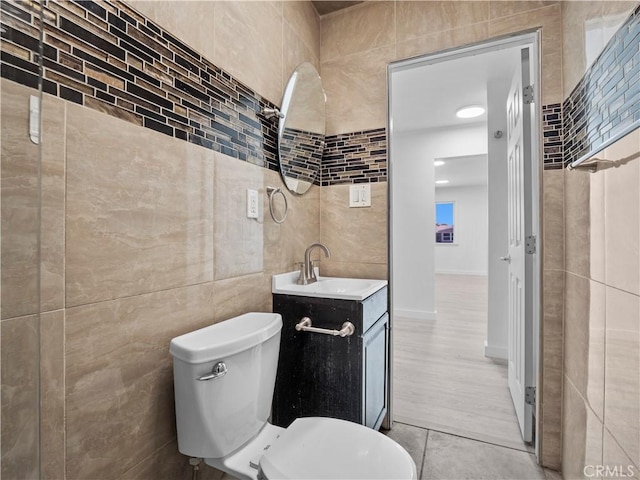 38809 Juniper Tree Rd, Palmdale, CA 93551 - bathroom with tile walls, vanity, and toilet