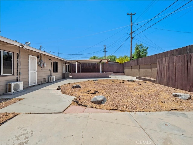 38809 Juniper Tree Rd, Palmdale, CA 93551 - fenced backyard with ac unit and a patio area