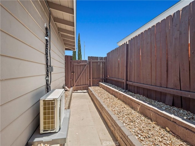 38809 Juniper Tree Rd, Palmdale, CA 93551 - view of property exterior featuring a gate and a cooling unit