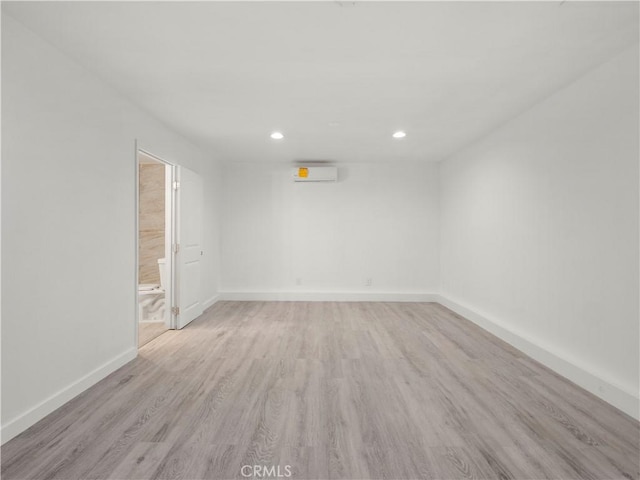 38809 Juniper Tree Rd, Palmdale, CA 93551 - empty room featuring a wall unit AC, light wood finished floors, recessed lighting, and baseboards