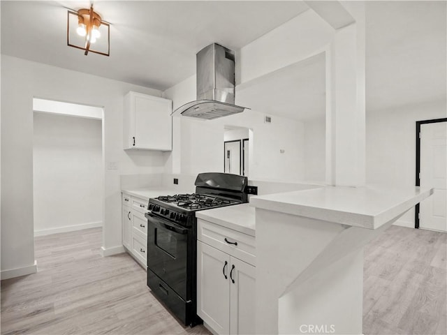 38809 Juniper Tree Rd, Palmdale, CA 93551 - kitchen featuring gas stove, island exhaust hood, a peninsula, and light countertops
