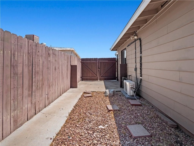 38809 Juniper Tree Rd, Palmdale, CA 93551 - view of yard featuring a gate and ac unit