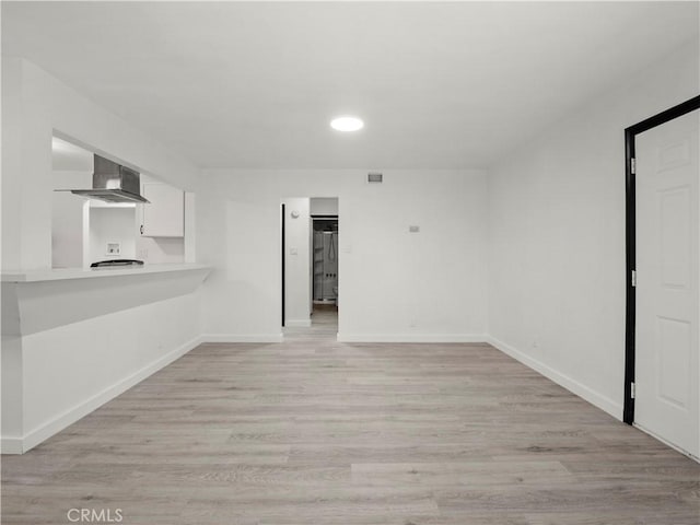 38809 Juniper Tree Rd, Palmdale, CA 93551 - unfurnished living room with light wood-style floors, baseboards, and recessed lighting
