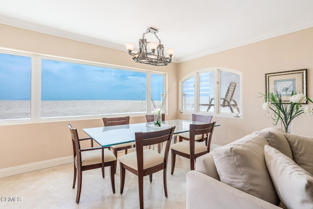 4165 Ocean Dr, Oxnard, CA 93035 - dining area featuring a chandelier, ornamental molding, baseboards, and light tile patterned floors