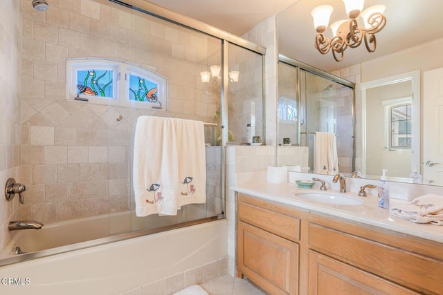 4165 Ocean Dr, Oxnard, CA 93035 - full bath featuring a chandelier, vanity, and bath / shower combo with glass door