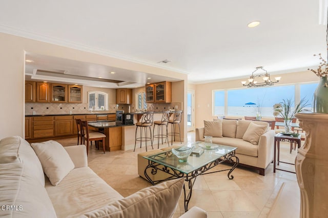 4165 Ocean Dr, Oxnard, CA 93035 - living area featuring a chandelier, ornamental molding, recessed lighting, and light tile patterned flooring