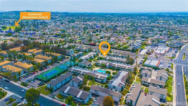 15321 Santa Gertrudes Ave Unit J210, La Mirada, CA 90638 - aerial view of property and surrounding area with nearby suburban area