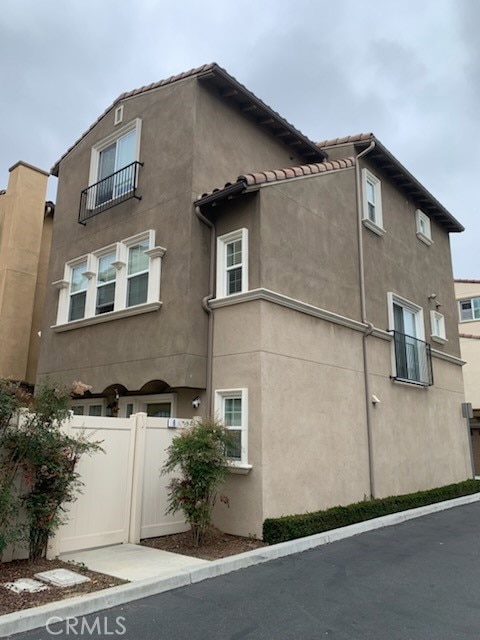 22111 Main St Unit 6, Carson, CA 90745 - view of property exterior featuring stucco siding and a garage