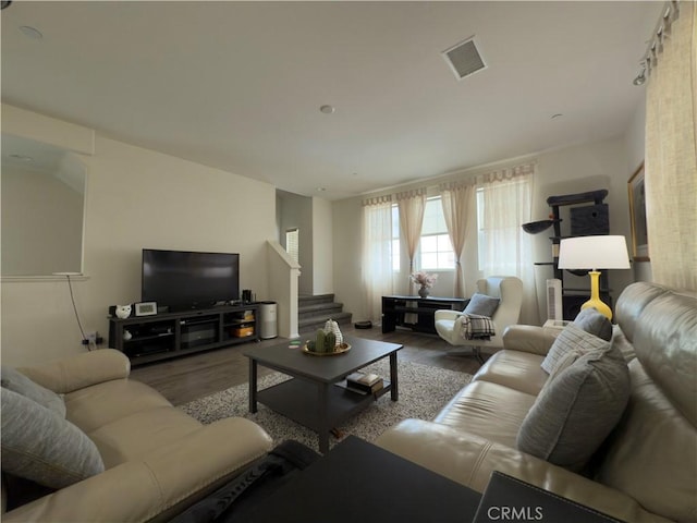 22111 Main St Unit 6, Carson, CA 90745 - living room with stairs and wood finished floors