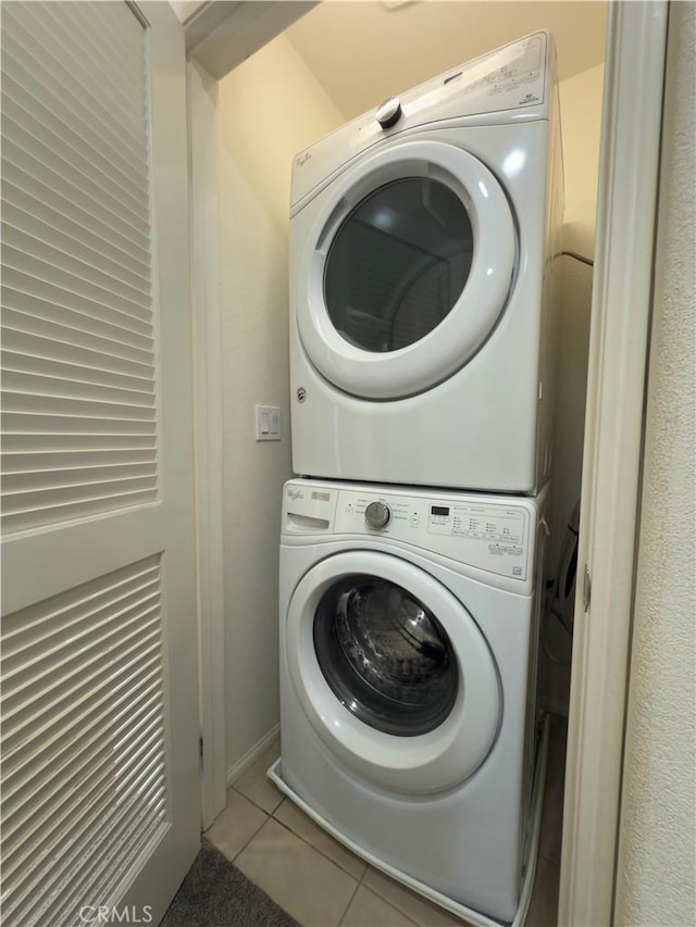 22111 Main St Unit 6, Carson, CA 90745 - washroom with stacked washer / dryer and tile patterned flooring