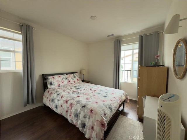 22111 Main St Unit 6, Carson, CA 90745 - bedroom with multiple windows and dark wood finished floors