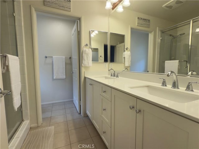 22111 Main St Unit 6, Carson, CA 90745 - bathroom with a stall shower, tile patterned flooring, and double vanity