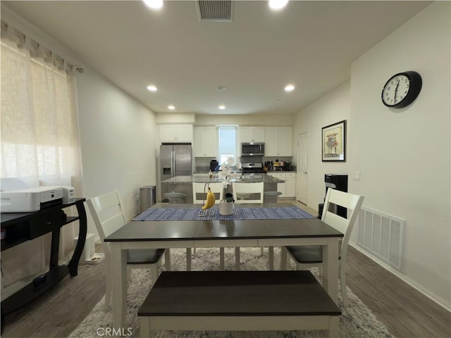 22111 Main St Unit 6, Carson, CA 90745 - dining room with dark wood-style flooring and recessed lighting