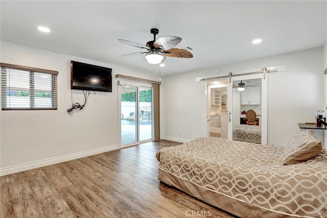 12081 Martha Ann Dr, Los Alamitos, CA 90720 - bedroom with access to outside, a barn door, wood finished floors, baseboards, and recessed lighting