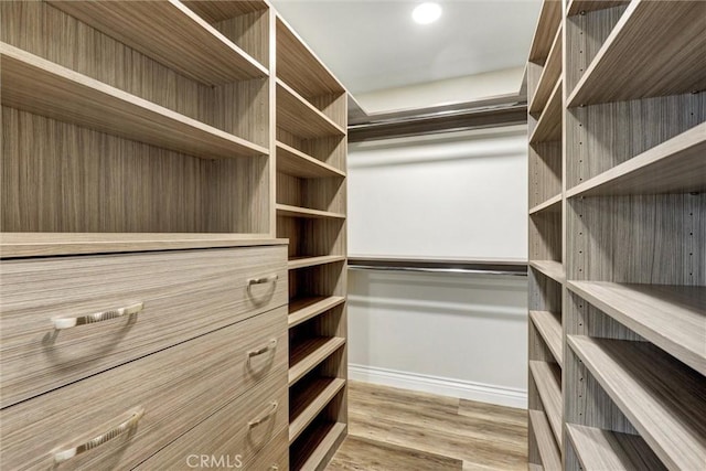 12081 Martha Ann Dr, Los Alamitos, CA 90720 - spacious closet with wood finished floors