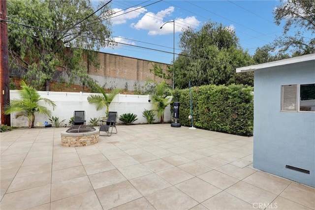 12081 Martha Ann Dr, Los Alamitos, CA 90720 - view of patio featuring a fire pit