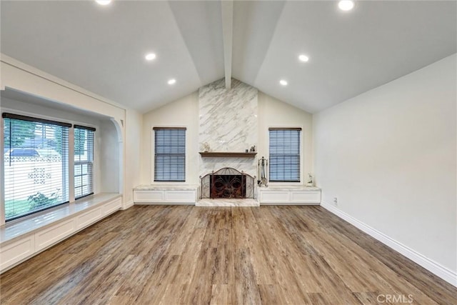 12081 Martha Ann Dr, Los Alamitos, CA 90720 - unfurnished living room with baseboards, wood finished floors, a fireplace, and recessed lighting