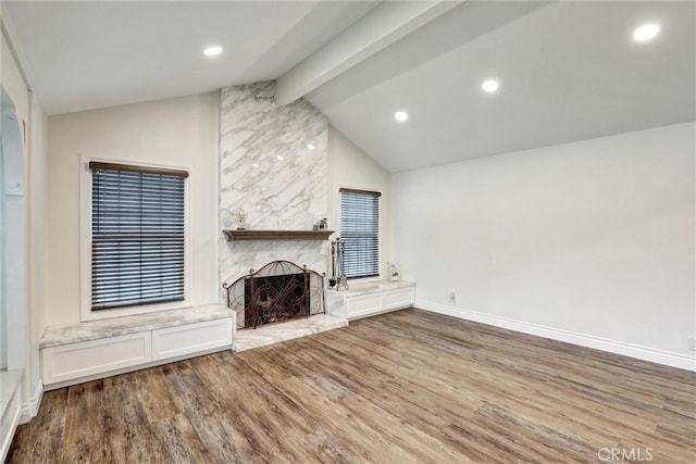 12081 Martha Ann Dr, Los Alamitos, CA 90720 - unfurnished living room with wood finished floors, a fireplace, baseboards, and recessed lighting