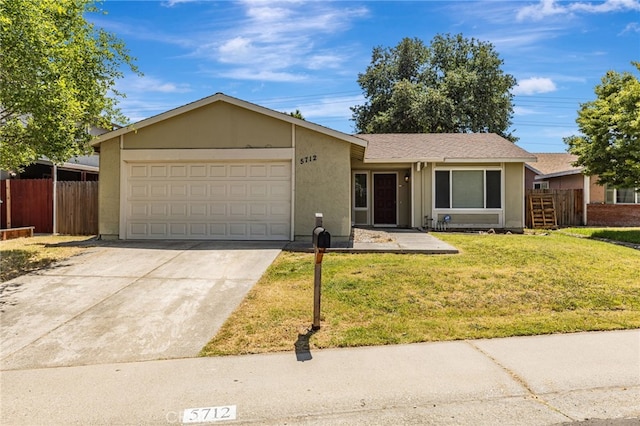 5712 Tupelo Dr, Sacramento, CA 95842 - ranch-style house featuring an attached garage, concrete driveway, and stucco siding