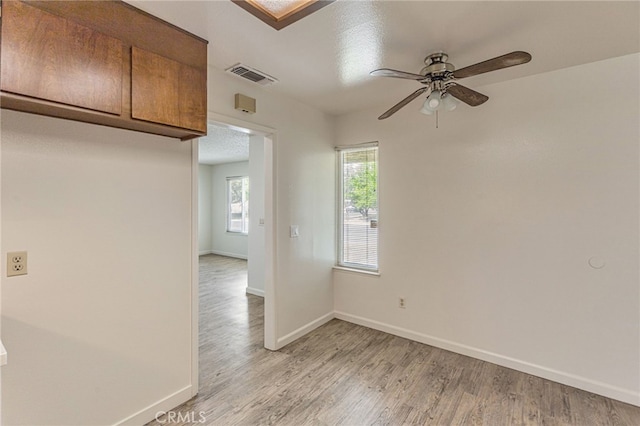 5712 Tupelo Dr, Sacramento, CA 95842 - unfurnished room with ceiling fan, light wood-style flooring, and baseboards