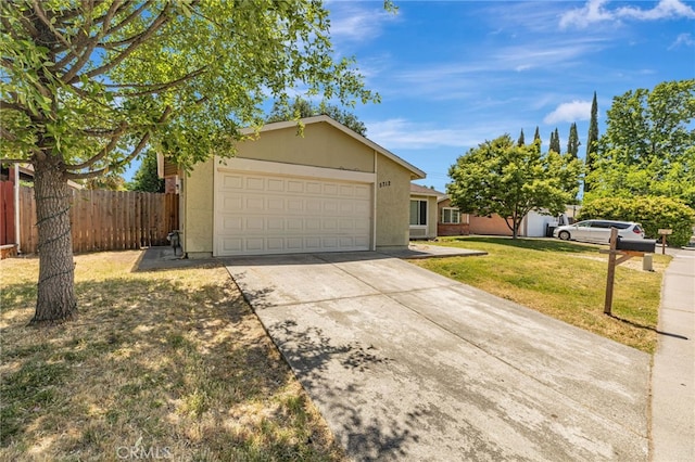 5712 Tupelo Dr, Sacramento, CA 95842 - view of front of house with an attached garage, concrete driveway, and stucco siding