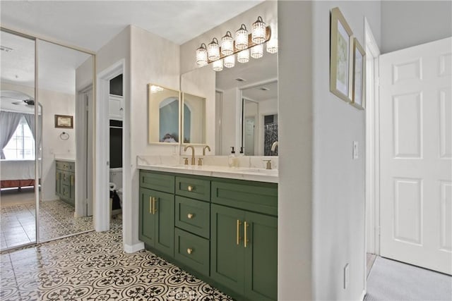 19 Tierra Montanosa, Rancho Santa Margarita, CA 92688 - full bath with double vanity, connected bathroom, toilet, and tile patterned flooring