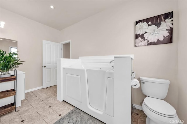 1107 Tennent Ave, Pinole, CA 94564 - bathroom featuring a garden tub, toilet, baseboards, and tile patterned flooring