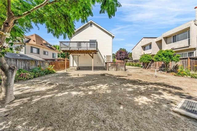 1107 Tennent Ave, Pinole, CA 94564 - back of house with a wooden deck, a fenced backyard, and stairs