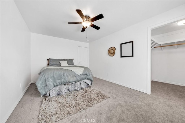1107 Tennent Ave, Pinole, CA 94564 - carpeted bedroom featuring baseboards, a walk in closet, a ceiling fan, and a closet