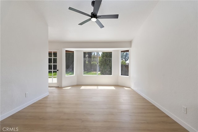 24185 Rimview Rd, Moreno Valley, CA 92557 - unfurnished room with light wood-style flooring, baseboards, ceiling fan, and a textured wall
