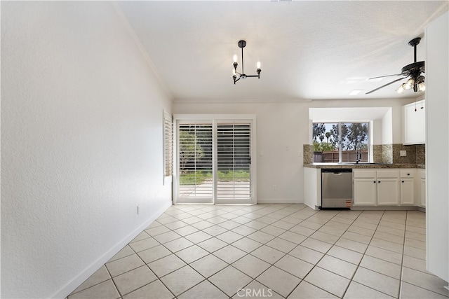 24185 Rimview Rd, Moreno Valley, CA 92557 - kitchen with stainless steel dishwasher, decorative backsplash, white cabinets, a ceiling fan, and a chandelier