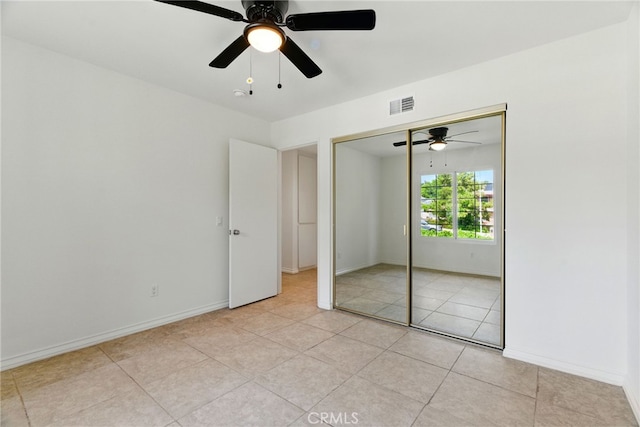 11340 Reseda Blvd, Porter Ranch, CA 91326 - unfurnished bedroom with light tile patterned floors, baseboards, ceiling fan, and a closet