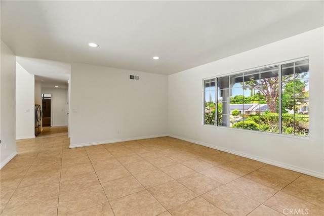 11340 Reseda Blvd, Porter Ranch, CA 91326 - spare room with recessed lighting, light tile patterned floors, baseboards, and washer / dryer