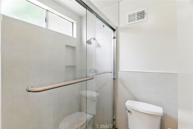 11340 Reseda Blvd, Porter Ranch, CA 91326 - bathroom with toilet, a shower stall, and tile walls