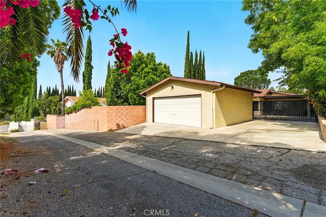 11340 Reseda Blvd, Porter Ranch, CA 91326 - garage featuring concrete driveway and a gate