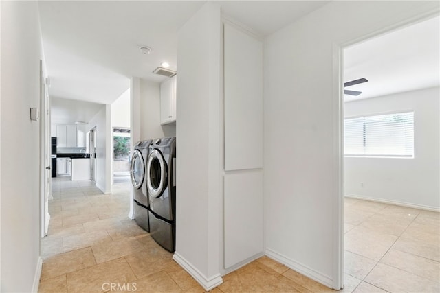11340 Reseda Blvd, Porter Ranch, CA 91326 - laundry area with washing machine and dryer, cabinet space, plenty of natural light, and light tile patterned flooring