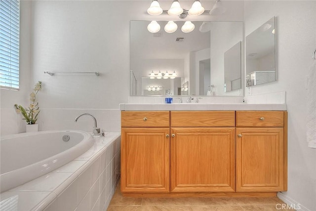 4451 Terry St, Chino, CA 91710 - full bathroom featuring vanity, a garden tub, and tile patterned flooring