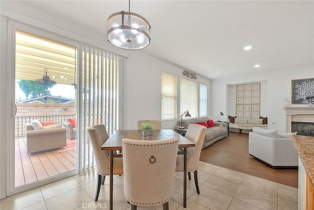 4451 Terry St, Chino, CA 91710 - dining area with light tile patterned floors, a chandelier, a glass covered fireplace, and recessed lighting
