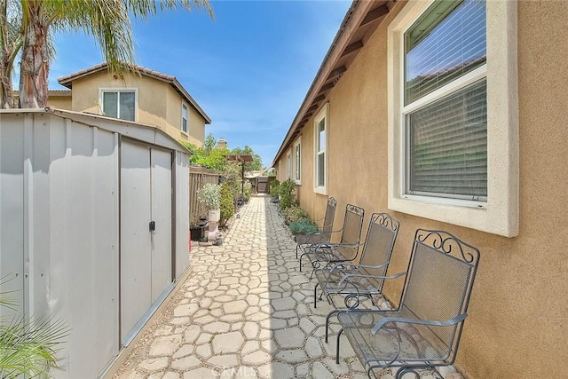 4451 Terry St, Chino, CA 91710 - view of side of property featuring stucco siding and a patio
