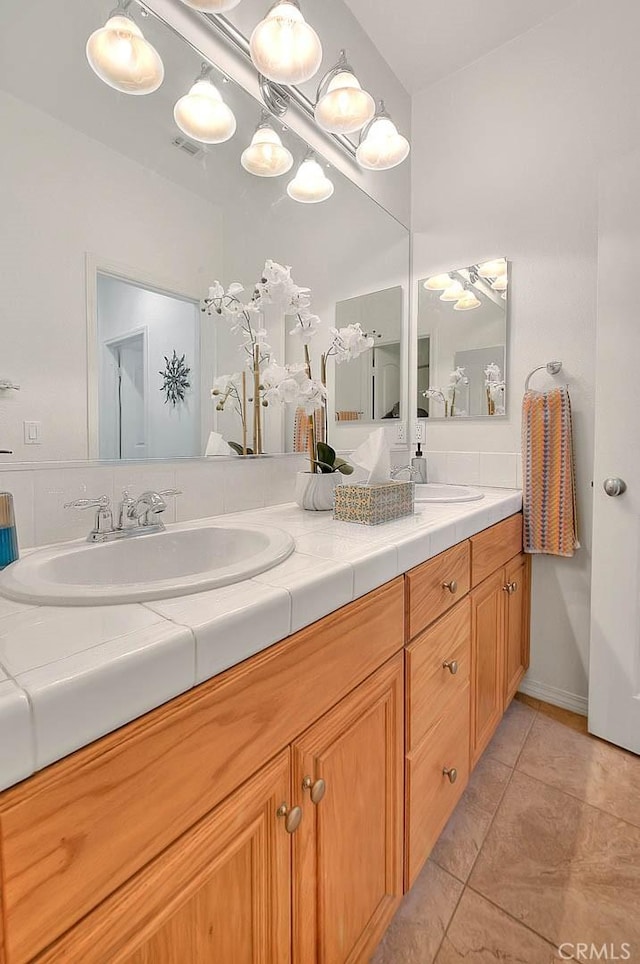 4451 Terry St, Chino, CA 91710 - full bath with double vanity and tile patterned flooring