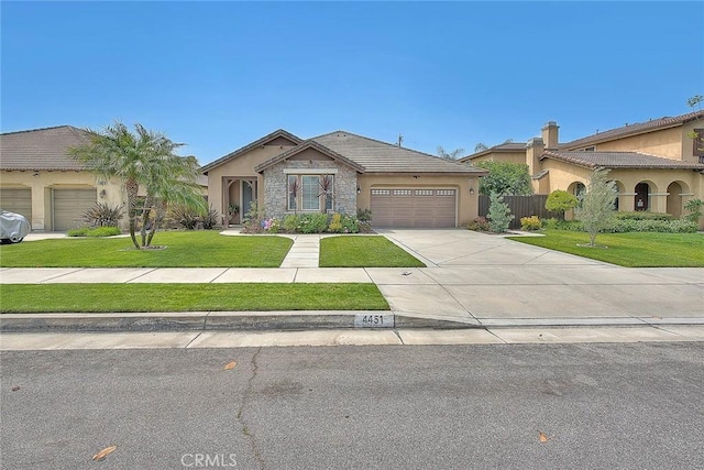 4451 Terry St, Chino, CA 91710 - view of front facade featuring a garage, stucco siding, driveway, stone siding, and a tile roof