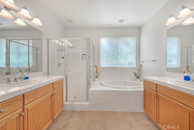 4451 Terry St, Chino, CA 91710 - full bathroom featuring tile patterned flooring, two vanities, a stall shower, and a garden tub