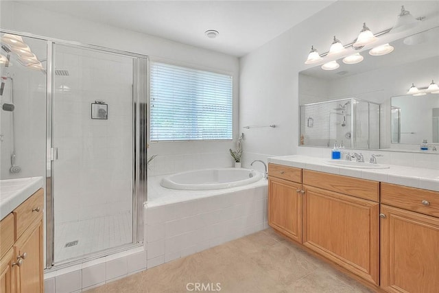 4451 Terry St, Chino, CA 91710 - bathroom with vanity, a stall shower, a garden tub, and tile patterned flooring