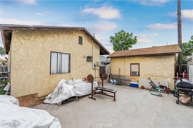 4639 Pine St, Pico Rivera, CA 90660 - back of house with stucco siding and a patio area