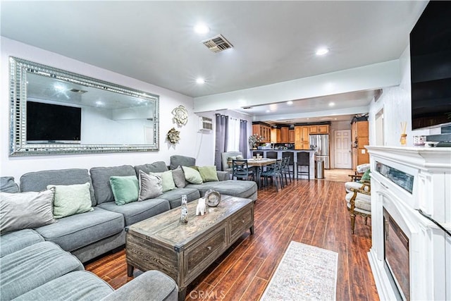 4639 Pine St, Pico Rivera, CA 90660 - living room with dark wood-type flooring and recessed lighting
